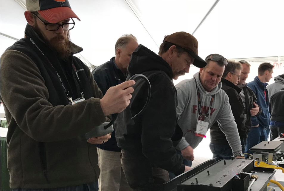 Hearth pros examine a gas appliance during hands-on training